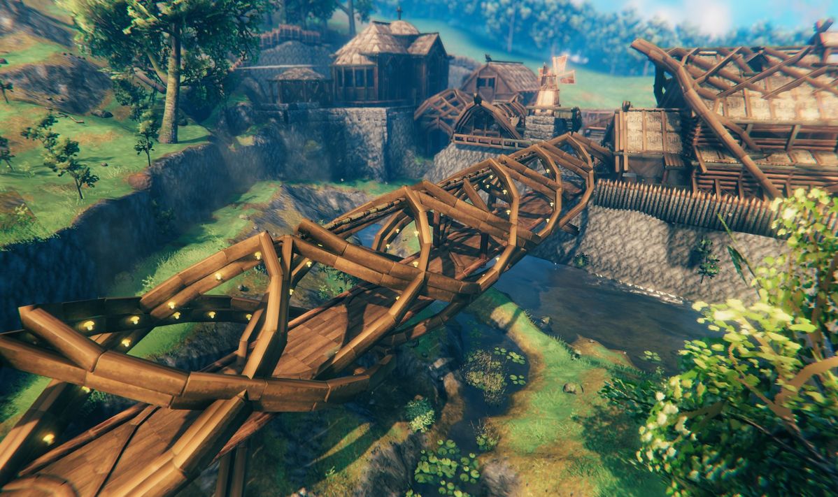 Pont en bois reliant les constructions d’un village dans Valheim